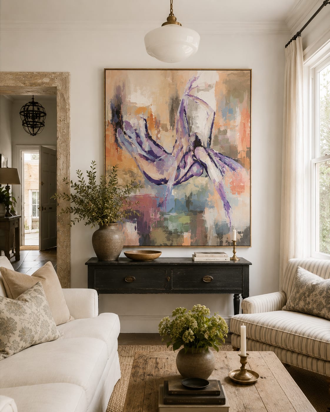 Living room with abstract painting and styled console